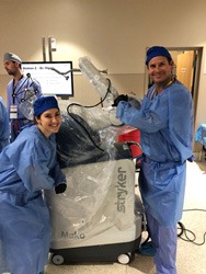 Robotic Technology Conference - Dr. Gerhardt and Tanya Cariveau posing with Mako Robot!